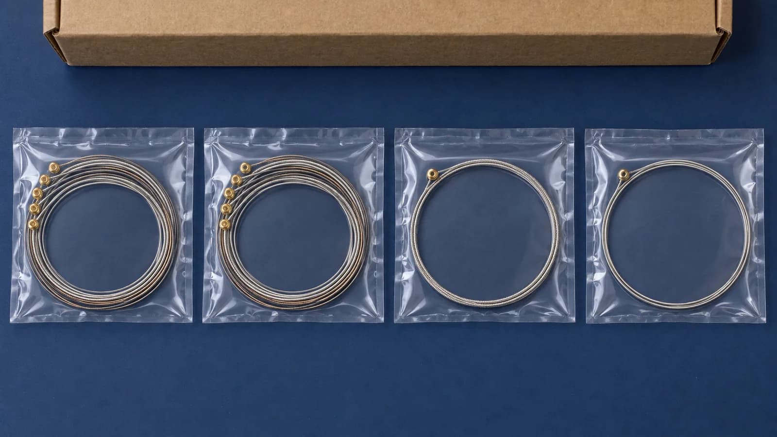 Illustrative grouped guitar-string packs and individual strings in unmarked bags