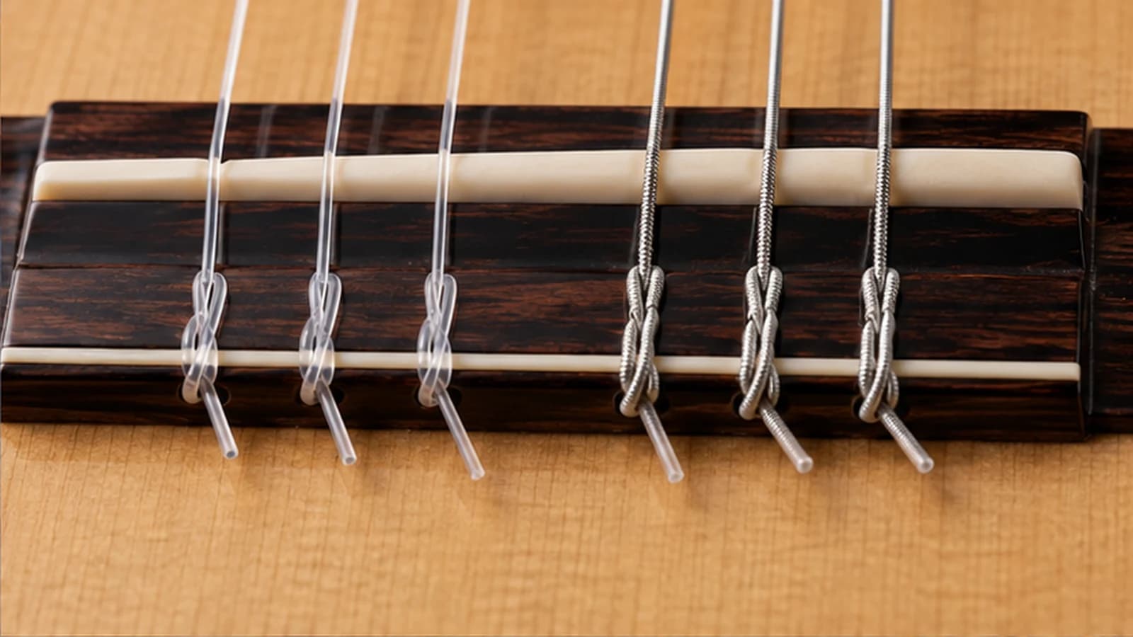 cuerdas de guitarra clásica para anudar — bloque de amarre del puente